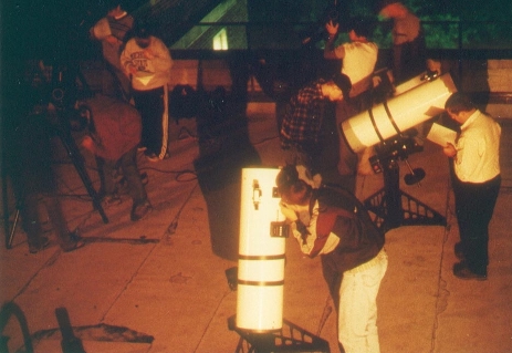 Students using rooftop telescopes
