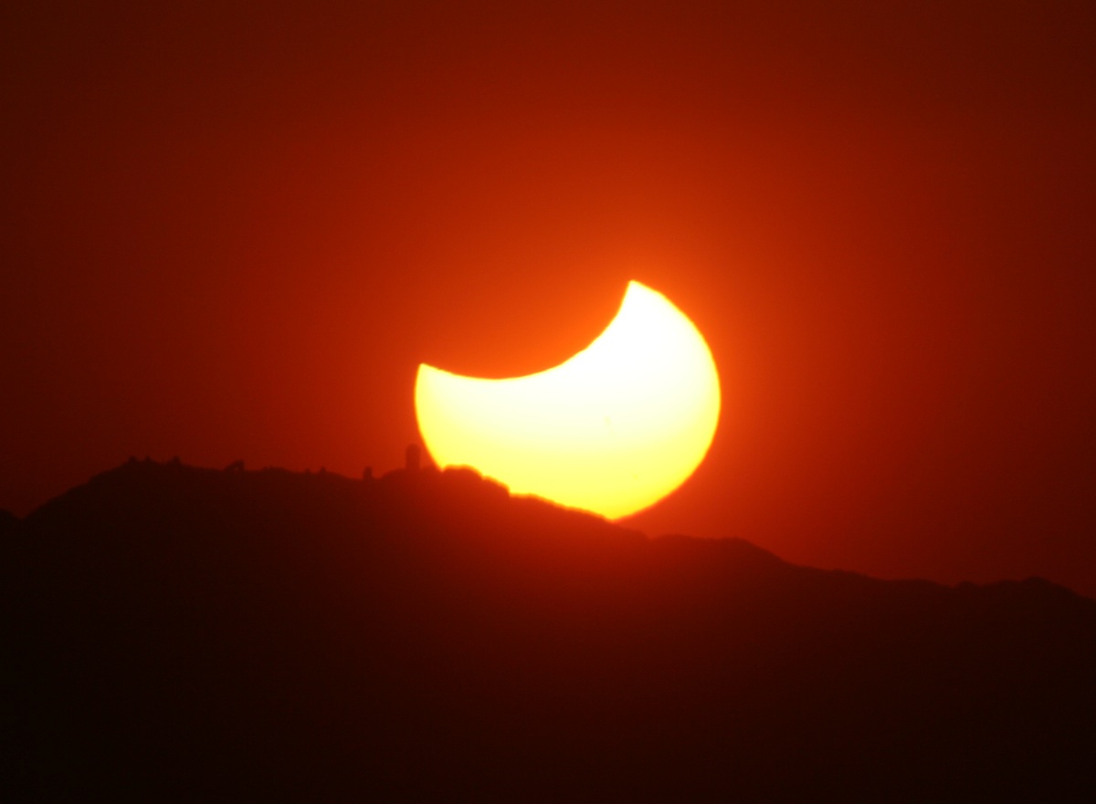 Setting eclipsed Sun over Kitt Peak from Mt. Hopkins